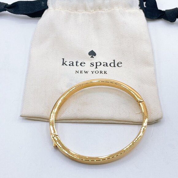 Kate Spade Gold Tone Bangle Bracelet Engraved Logo Clasp Closure - Picture 1 of 6